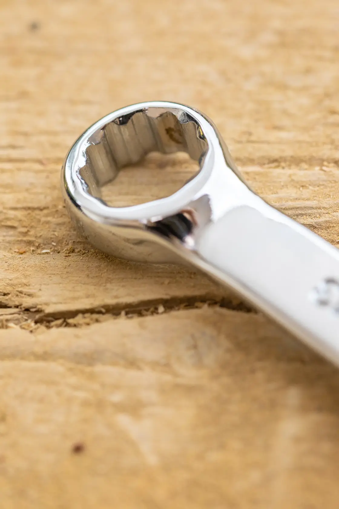 STANLEY STMT95791-0 photography of chrome box end wrench on wood surface, close-up view.
